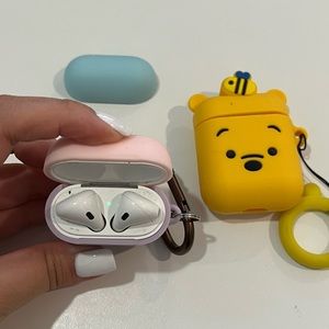 Apple AirPods (1st generation) with 2 cases included